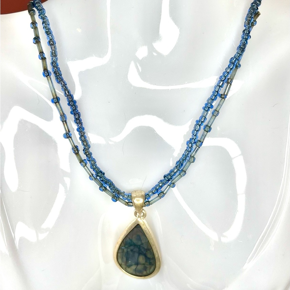 Triple Strand Blue Beaded Necklace with Teardrop Pendant